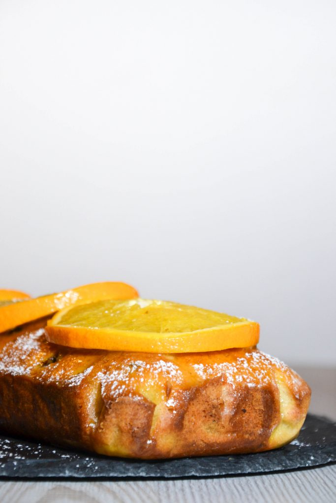 Lemon loaf with orange glaze and orange slices